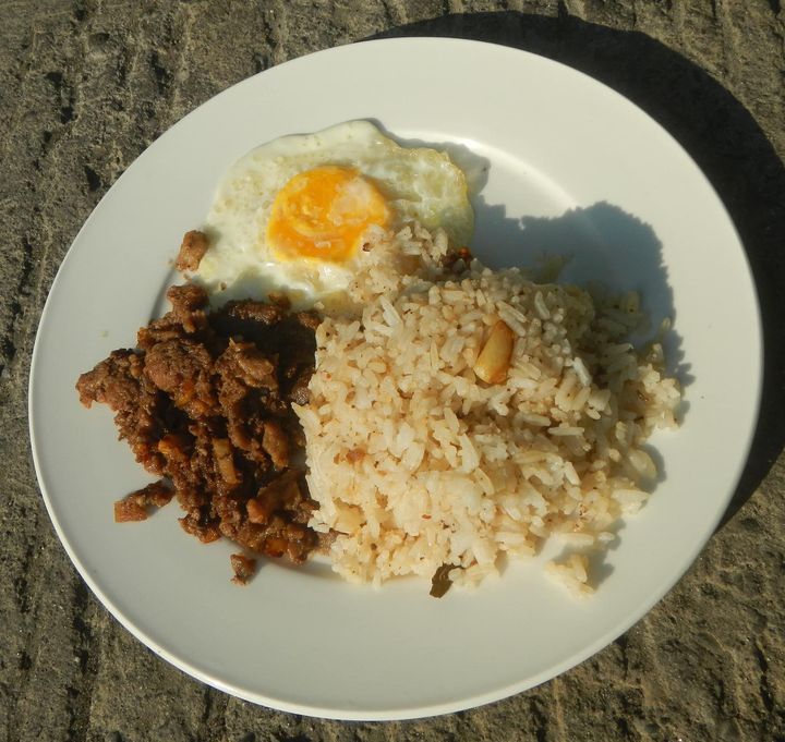 Plate of tapa with garlic fried rice and a fried egg